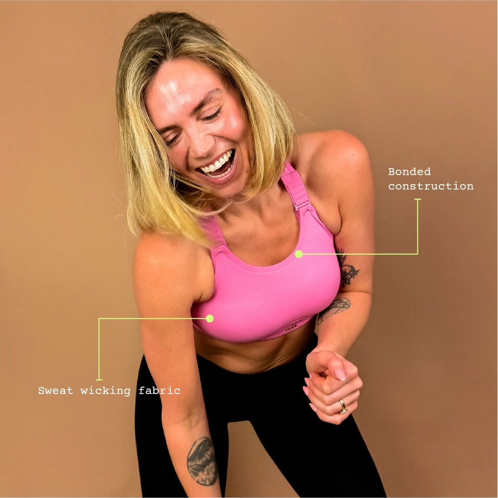 Model wearing Cloud sports bra during gym-style movement, designed for comfort and ease of movement.