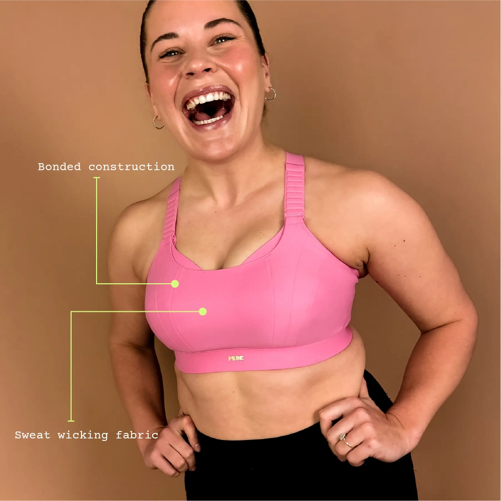 Pink high impact sports bra providing strong support for running and gym workouts.