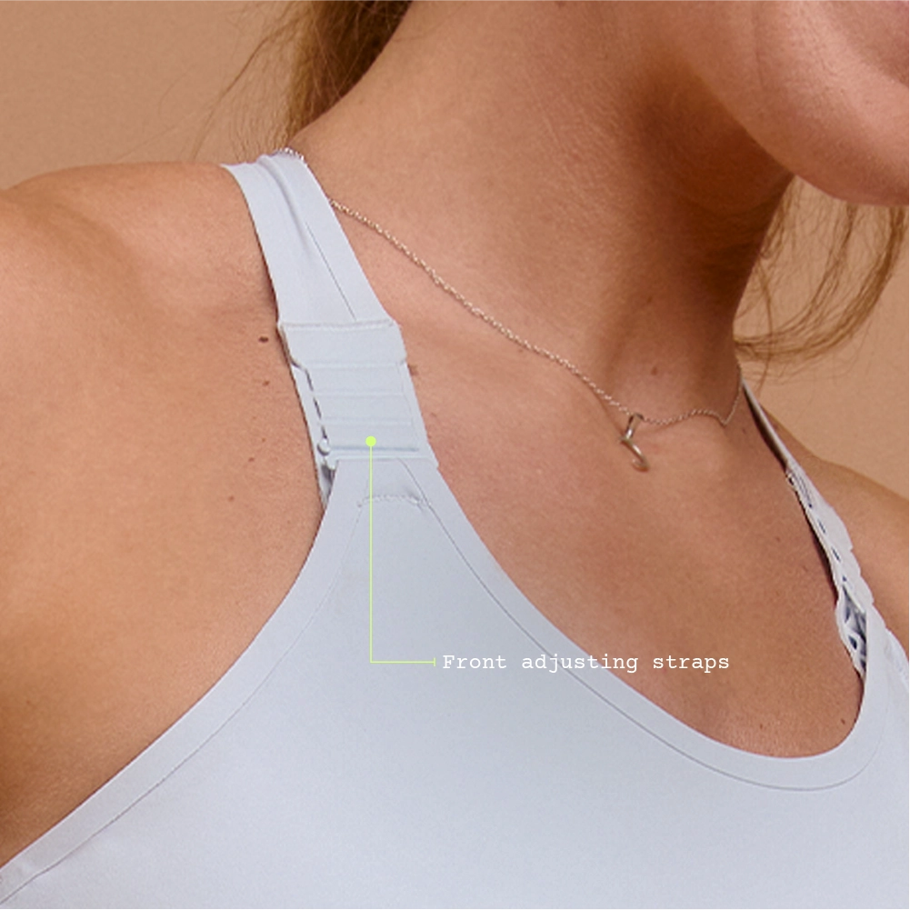 Close-up of strap detail on light blue adjustable sports bra
