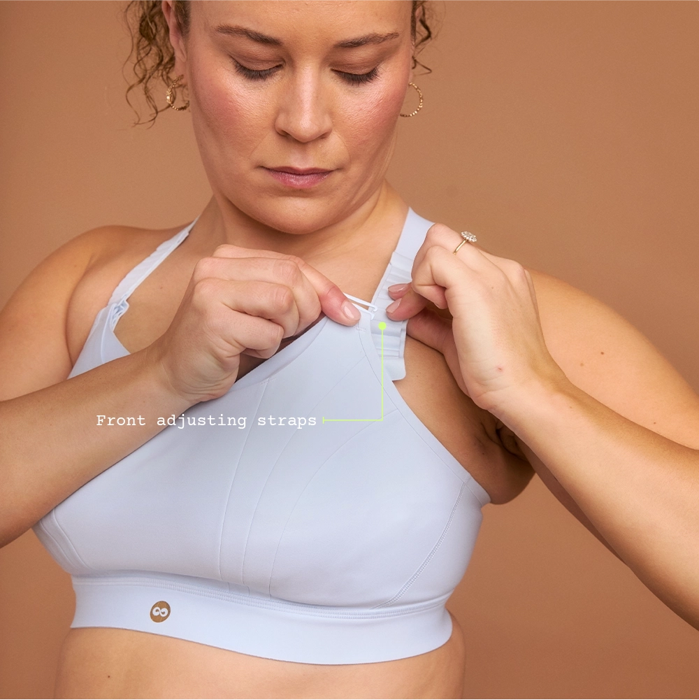 Close-up adjusting strap on light blue adjustable high impact sports bra