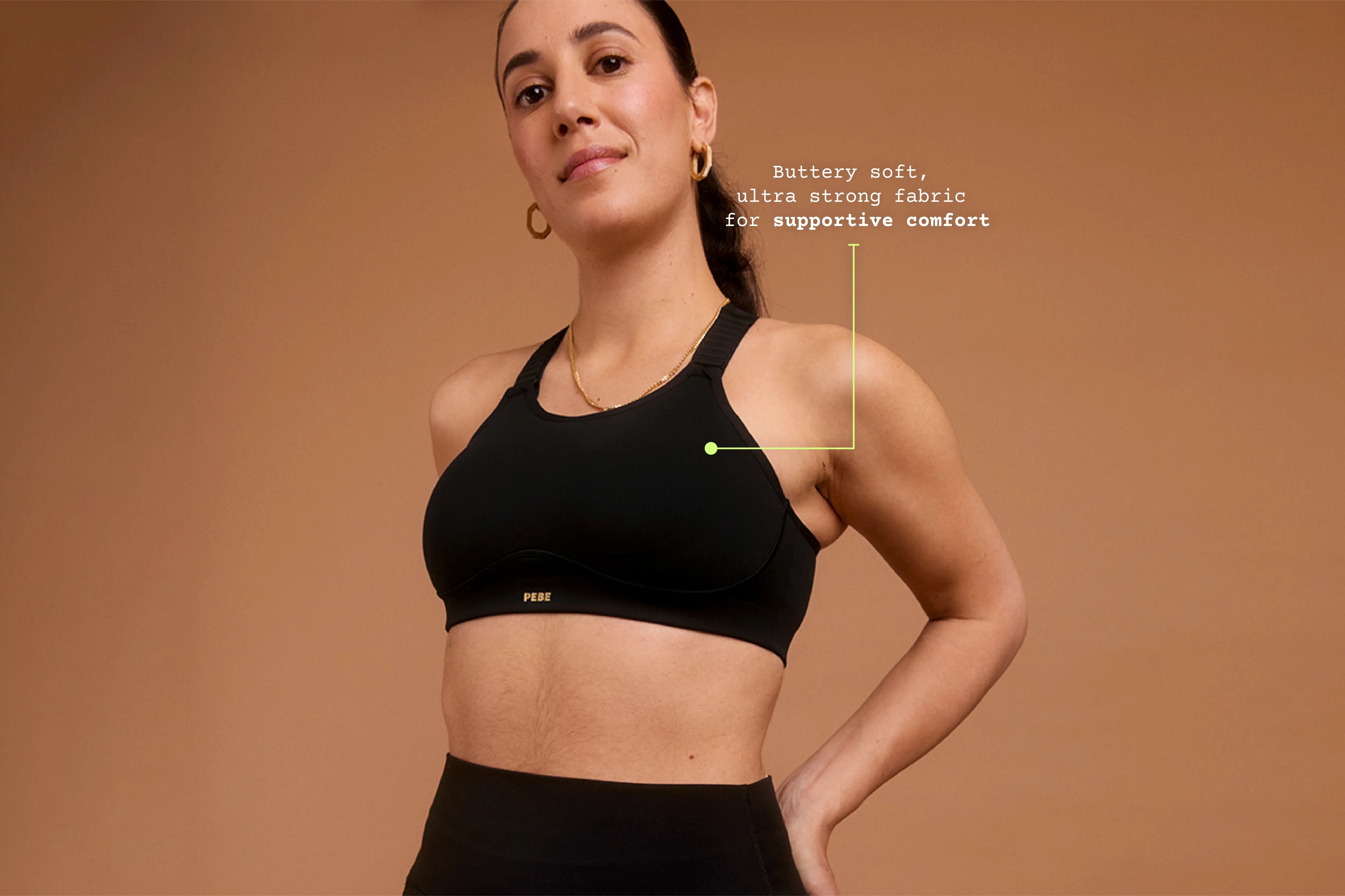 Front view of model wearing black Cloud sports bra, showing smooth fabric and supportive fit.