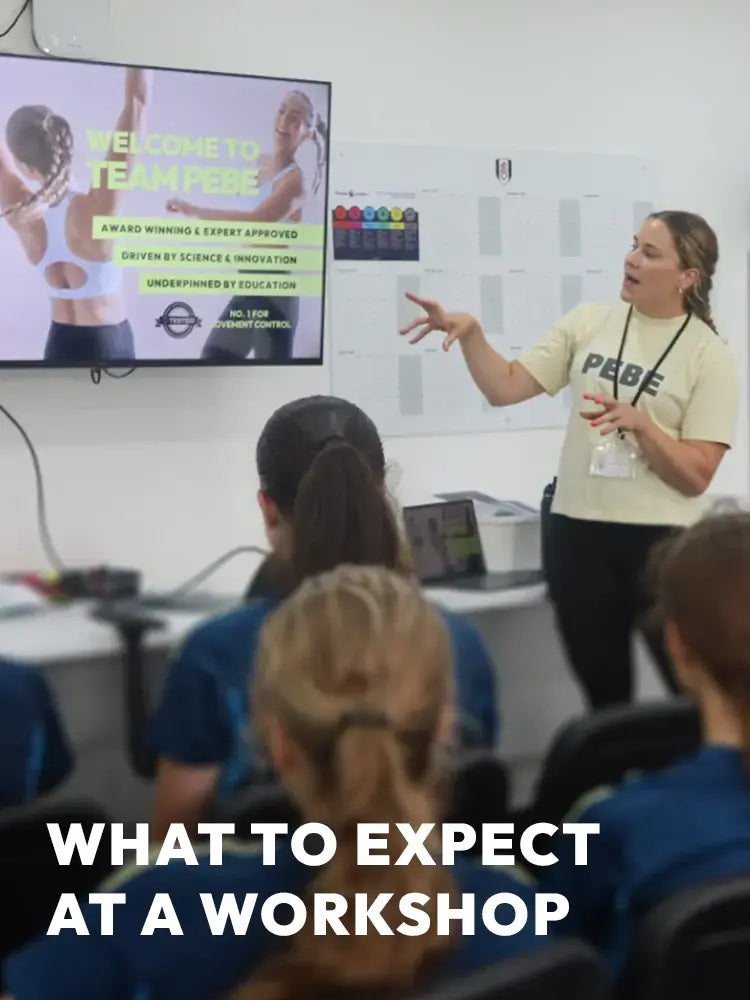 PEBE instructor presenting to students during a sports bra education workshop session.